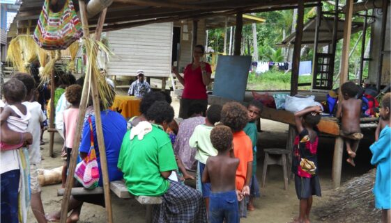 Christine Schreyer runs a workshop at which young and old learn their own newly-created Kala alphabet.